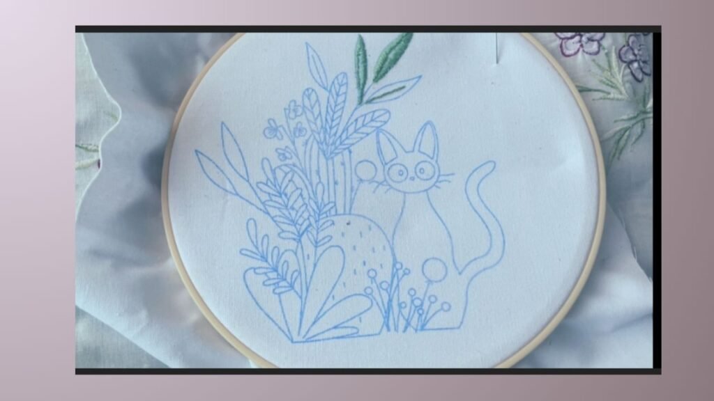 The black cat design on the hoop