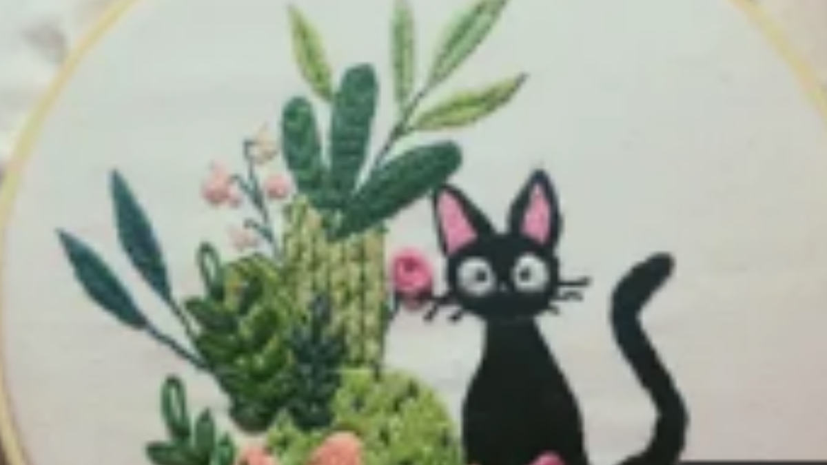 Embroider a black kitten Ghibli-style with flowers